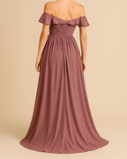 The Delina Off-shoulder long dress in mauve blush pink, made from sustainable recycled polyester chiffon. Shown from the back view. Ethically made in London by ADKN