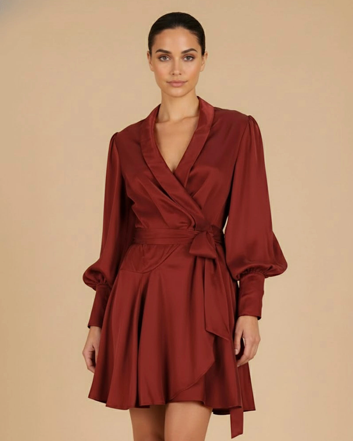Close-up of model wearing the Elye Mini Wrap Dress in Deep Burgundy Red, focused on the neckline, wrap tie, and elegant silhouette.