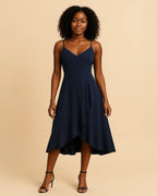 Front view of Elysian ruffle midi dress in blush pink made from recycled polyester. Designed by ADKN