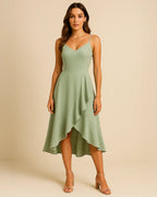 Front view of Elysian ruffle midi dress in sage green made from recycled polyester. Designed by ADKN