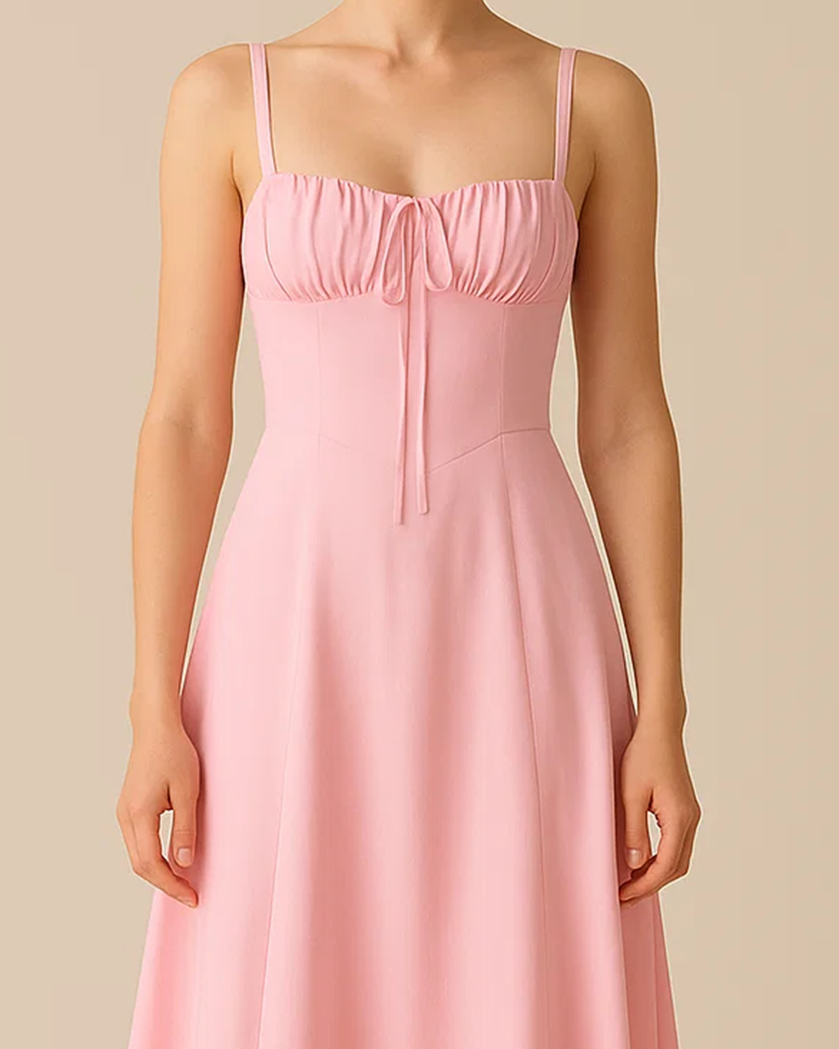 The Heidi corset milkmaid midi dress in pastel pink, made from sustainable recycled polyester. Shown from the front view. Ethically made in London by ADKN