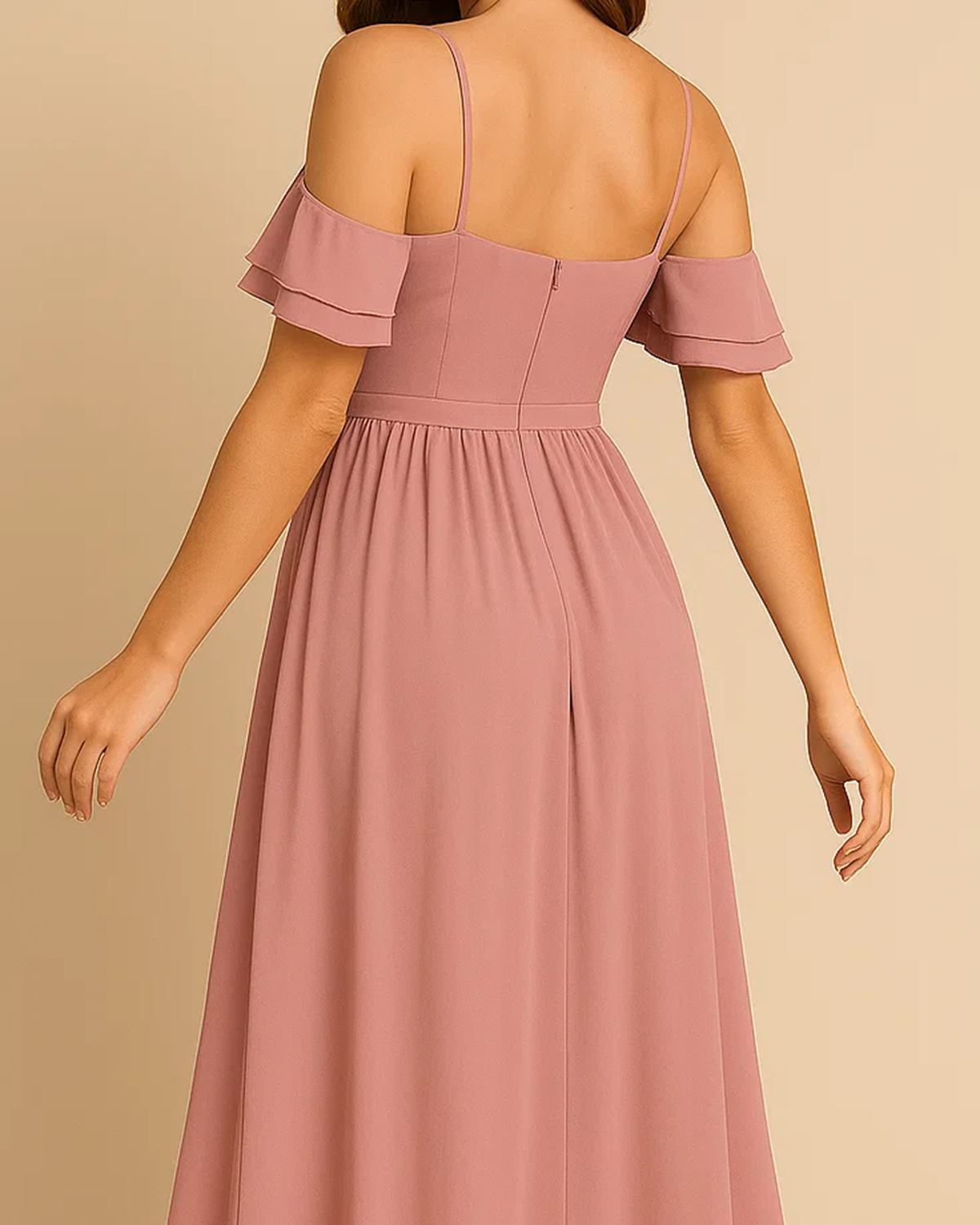 The Liora High-low off the shoulder dress in pastel pink, made from sustainable recycled polyester chiffon. Shown from the back view. Ethically made in London by ADKN