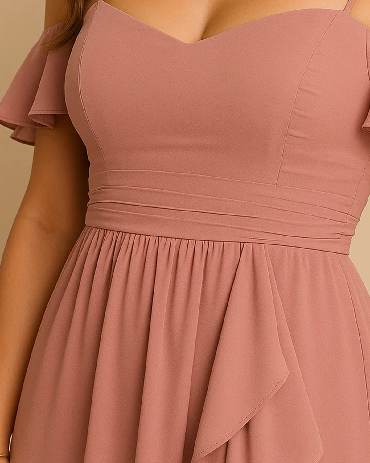 The Liora High-low off the shoulder dress in pastel pink, made from sustainable recycled polyester chiffon. Shown from the upclose view view. Ethically made in London by ADKN