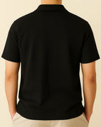 Rear view of black ribbed men’s shirt – relaxed recycled knit