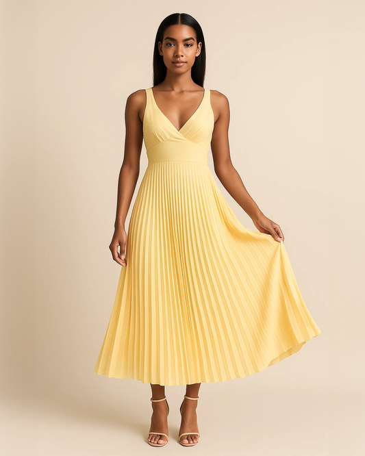 Soleil pleated midi dress in butter yellow, crafted from recycled polyester. Vegan, ethical fashion for wedding guest. Ethically made by ADKN in London
