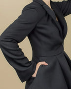 Kleitos Sustainable Black Peplum Blazer: RPET Newlife Eco-Luxury with Corozo Buttons