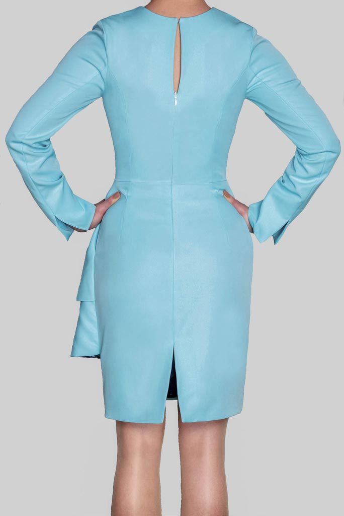 Back view of ADKN Abel baby blue Dress with sleeves and keyhole detail and slit made in UK from sustainable recycled bottles