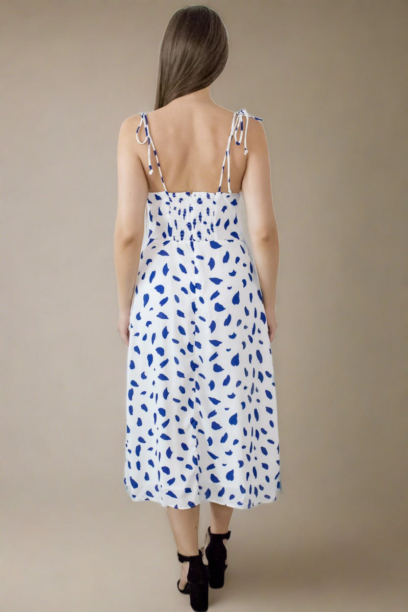 Back view of upcycled white chiffon midi summer dress with polka dots showing elastic back and zip