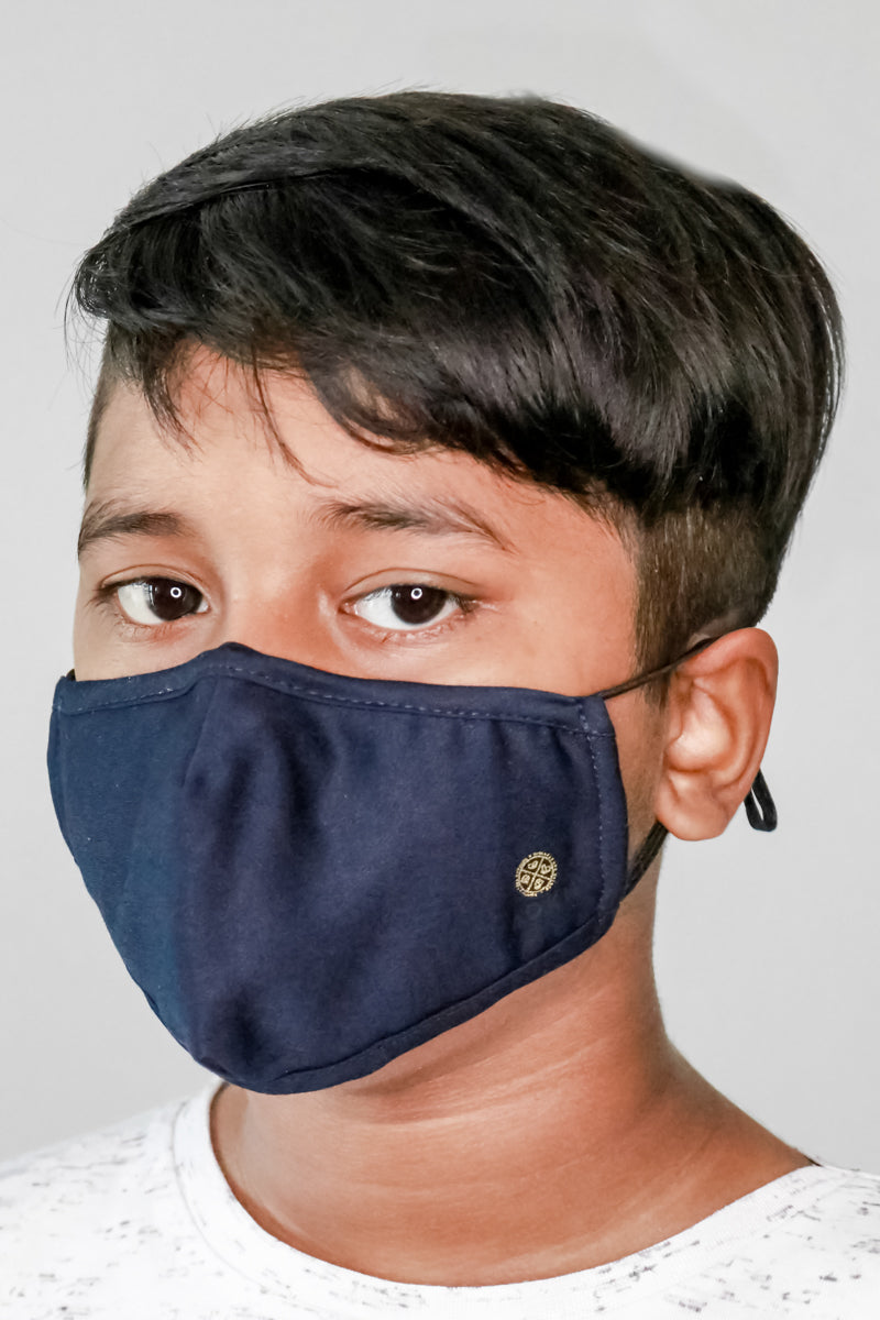 Child wearing ADKN 4 layer face mask from bamboo cloth