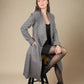 Profile view of tweed grey wool hemp Baldo swing flare Coat by ADKN made from light sustainable materials perfect for spring