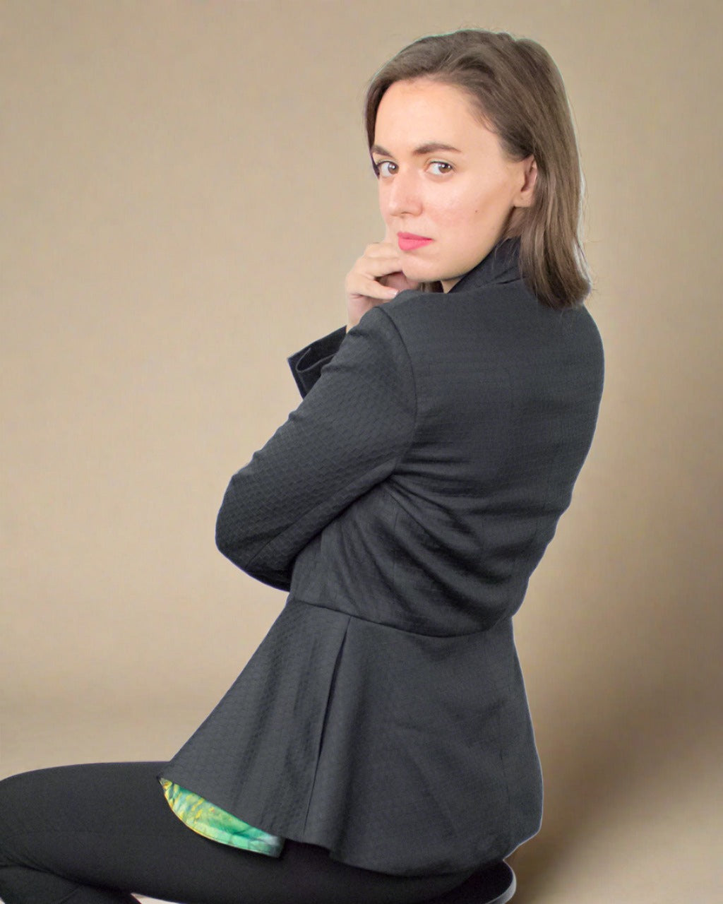 Sustainable basics by ADKN a smart peplum fitted tailored black blazer jacket with pockets made from recycled plastic bottles