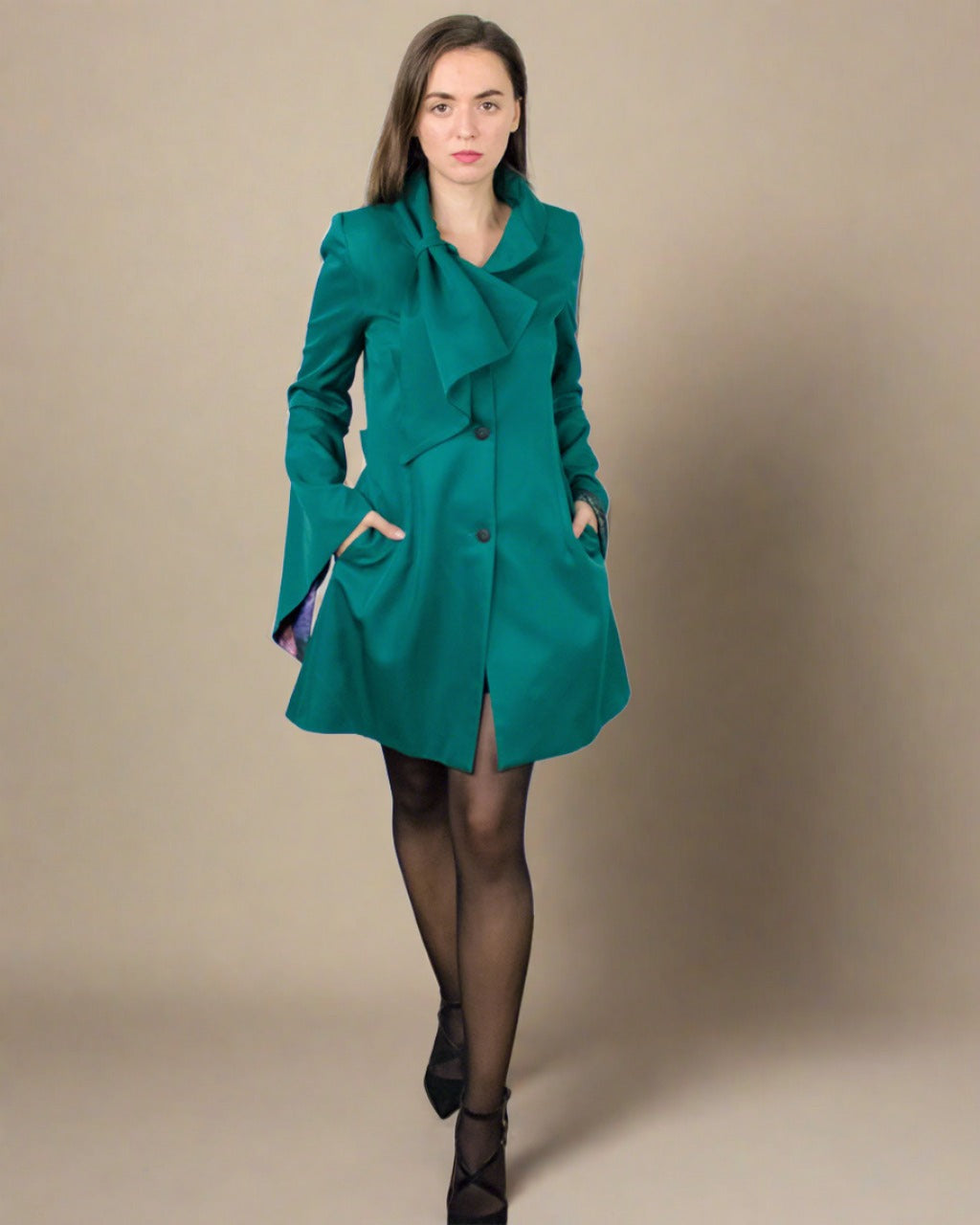 Designer ethical dark green ladies luxury trench coat with big bell sleeves ADKN made in UK from sustainable recycled bottles