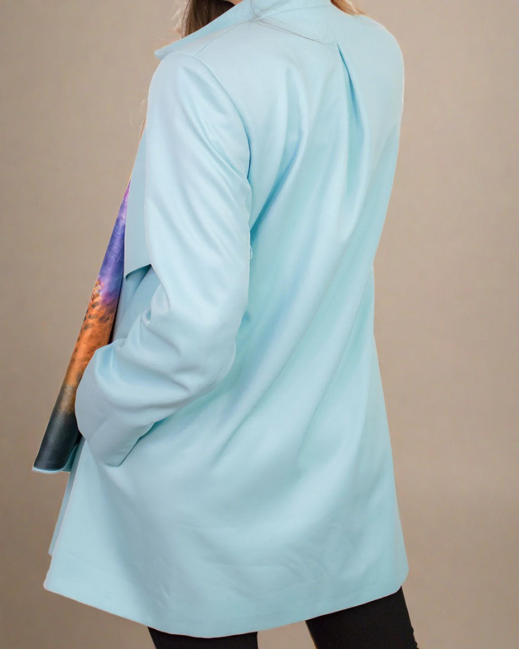 Back view of oversized blue coat ADKN