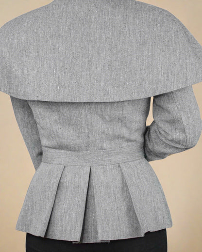 Back detail of cape and structured peplum of ethical Abbe Jacket fitted blazer by ADKN